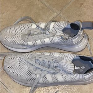 Grey and white adidas sock sneakers